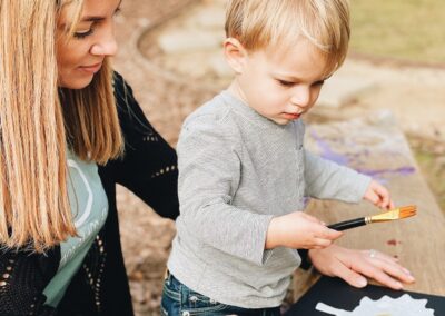 child and parent do crafts together