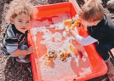 kids clean toys outside