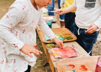 child works on paint project