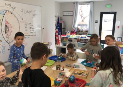 elementary students learning in classroom