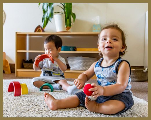 two toddlers playing side by side