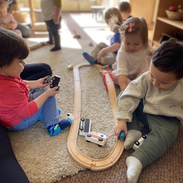 toddlers playing with trainer